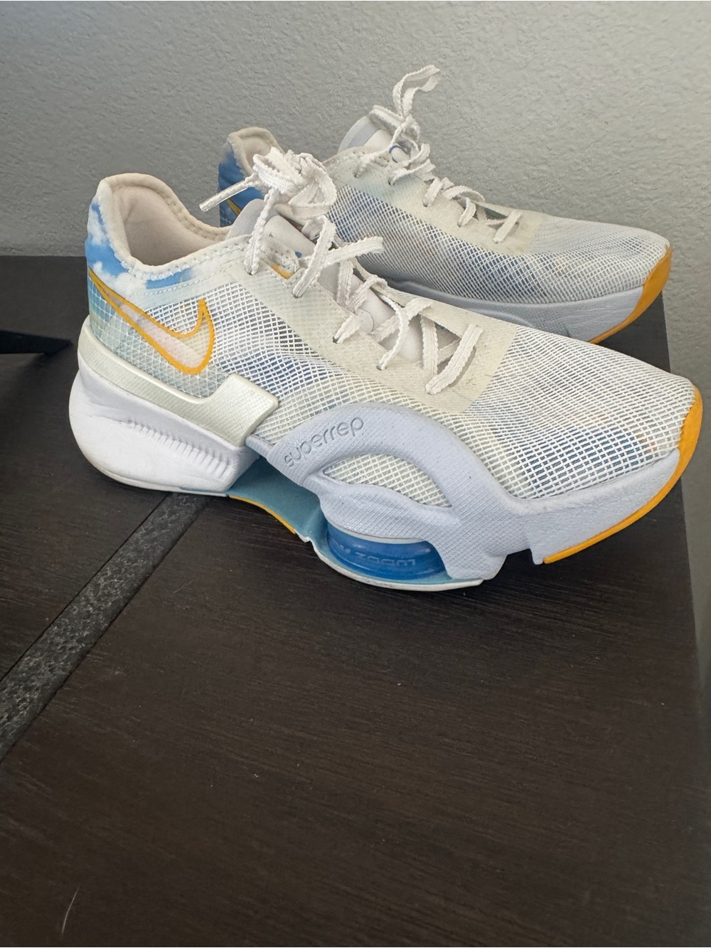 Nike White Mesh Sneakers with Blue and Yellow Accents